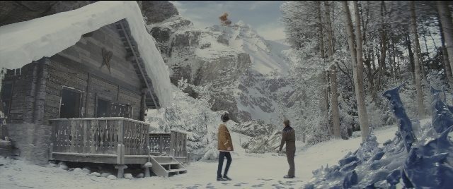 Wide shot frame from Kingsman: The Golden Circle — standing, house, forest