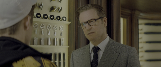 Medium shot frame from Kingsman: The Secret Service — standing, room, door