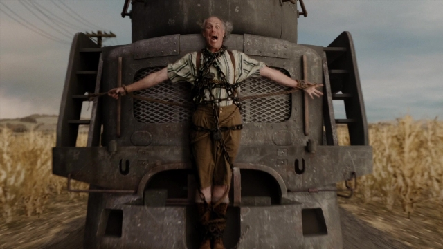 Wide shot frame from A Series of Unfortunate Events — standing, car, shirt