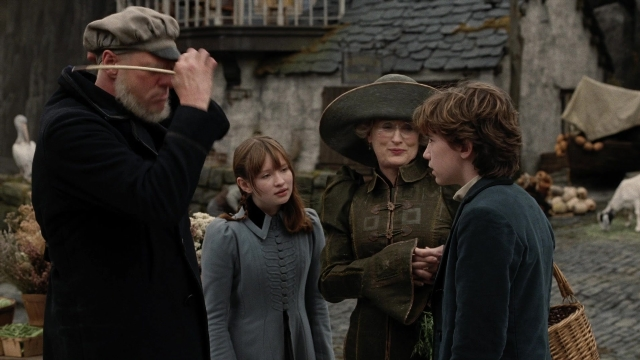 Wide shot frame from A Series of Unfortunate Events — standing, hat, dog