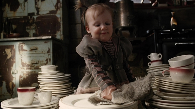 Wide shot frame from A Series of Unfortunate Events — standing, table, kitchen