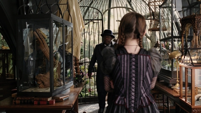 Wide shot frame from A Series of Unfortunate Events — walking, room, hat