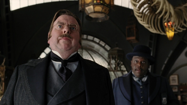 Wide shot frame from A Series of Unfortunate Events — standing, room, hat