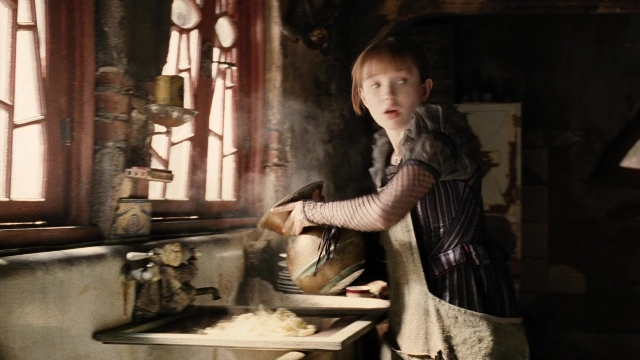 Wide shot frame from A Series of Unfortunate Events — standing, kitchen, hand