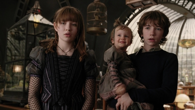 Wide shot frame from A Series of Unfortunate Events — standing, room, dress