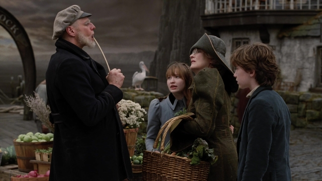 Wide shot frame from A Series of Unfortunate Events — standing, dialogue, coat