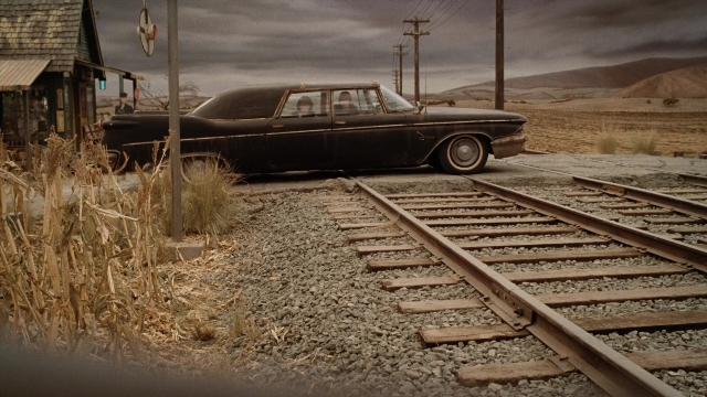Frame from A Series of Unfortunate Events — car, train, wheel
