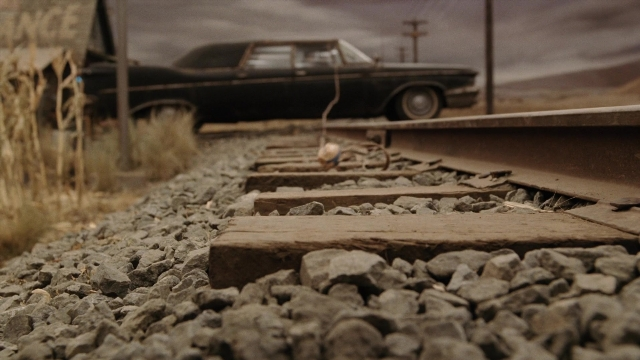 Wide shot frame from A Series of Unfortunate Events — car, train, wheel