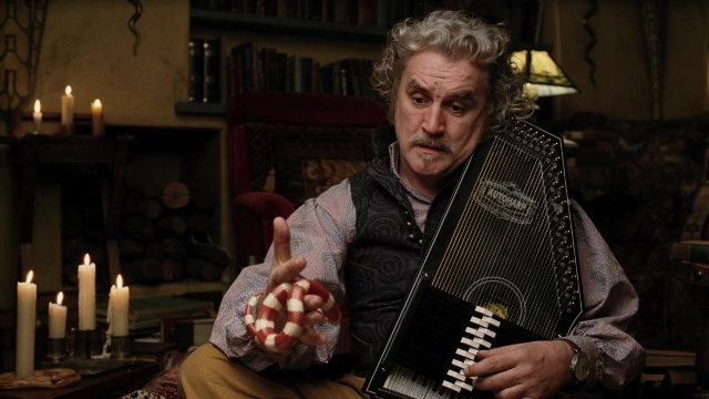 Wide shot frame from A Series of Unfortunate Events — sitting, room, shirt