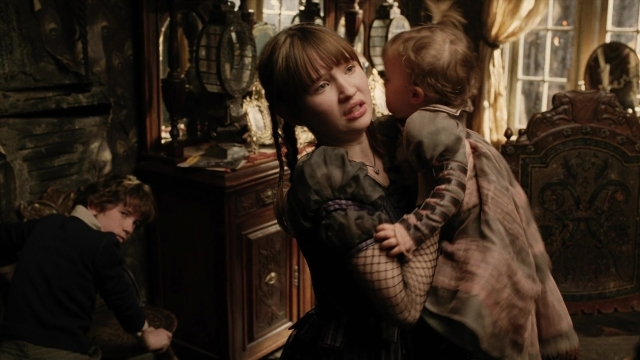 Medium shot frame from A Series of Unfortunate Events — standing, room, coat