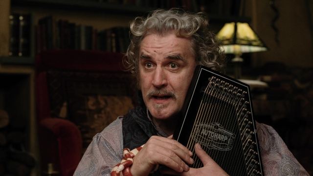 Medium shot frame from A Series of Unfortunate Events — sitting, room, shirt