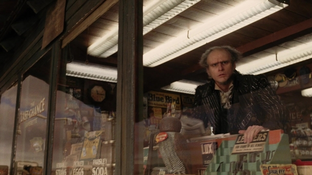 Wide shot frame from A Series of Unfortunate Events — standing, face, clock