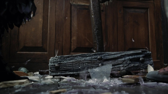 Wide shot frame from A Series of Unfortunate Events — door, glass, bird