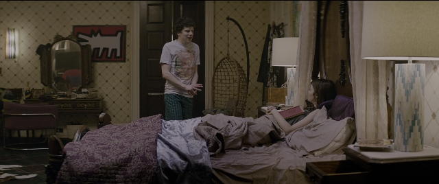 Wide shot frame from Zombieland: Double Tap — book, standing, room