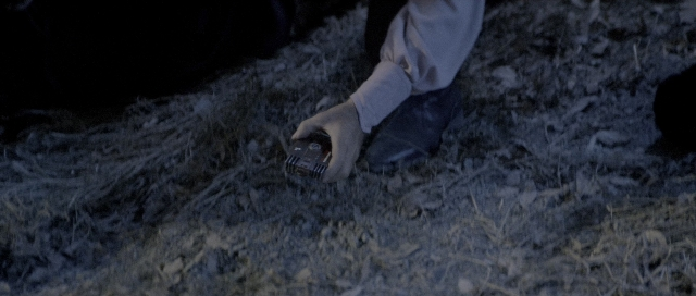 Wide shot frame from Star Trek III: The Search for Spock — bed, hand, person