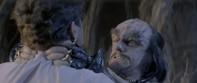 Wide shot frame from Star Trek III: The Search for Spock — hand, shirt, face