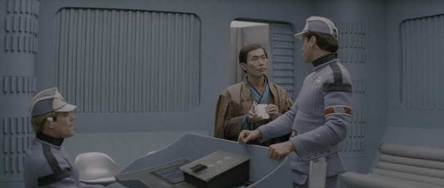 Wide shot frame from Star Trek III: The Search for Spock — sitting, standing, room