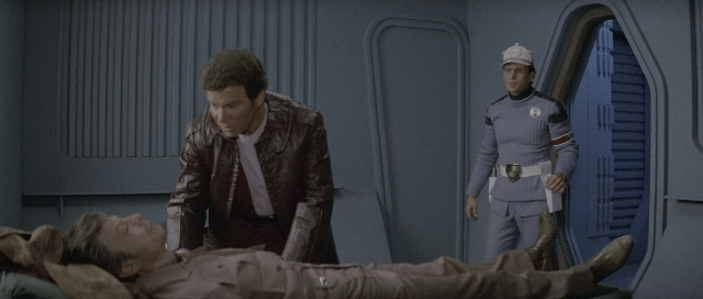 Wide shot frame from Star Trek III: The Search for Spock — standing, room, bed