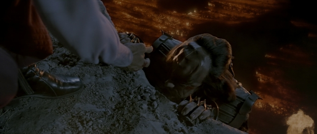 Wide shot frame from Star Trek III: The Search for Spock — fire, dog, hand