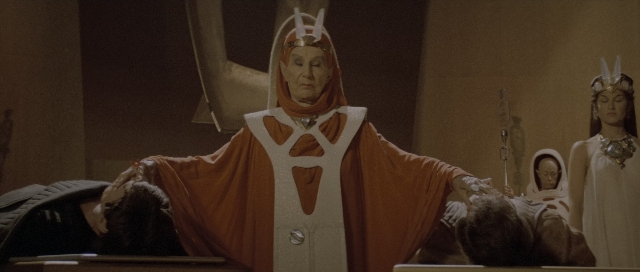 Wide shot frame from Star Trek III: The Search for Spock — standing, dress, face