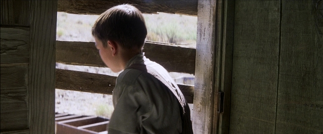 Frame from There Will Be Blood — standing, face, person
