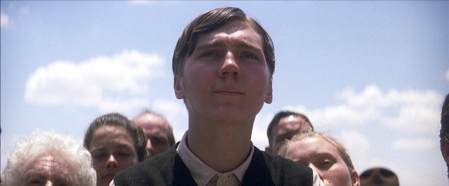 Medium shot frame from There Will Be Blood — suit, tie, face