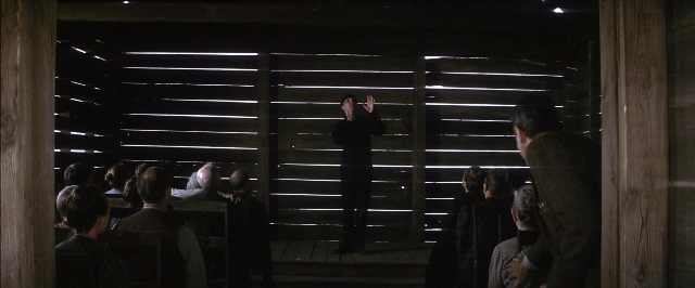 Frame from There Will Be Blood — sitting, standing, room