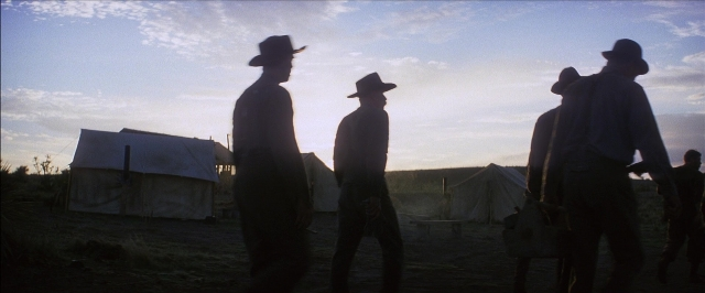 Wide shot frame from There Will Be Blood — standing, person