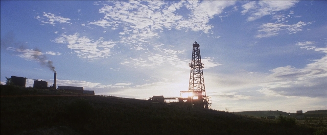 Frame from There Will Be Blood — tower, smoke
