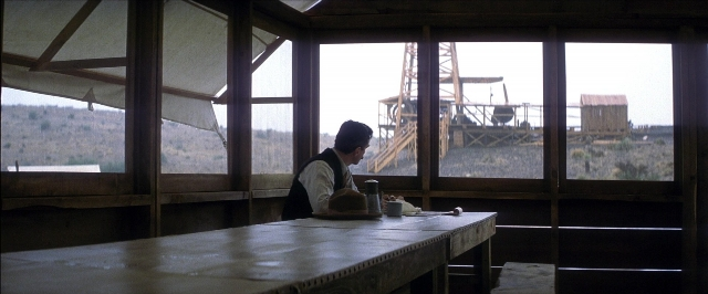 Frame from There Will Be Blood — sitting, room, table