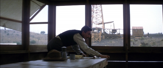Frame from There Will Be Blood — sitting, room, table