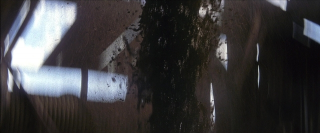 Wide shot frame from There Will Be Blood — window
