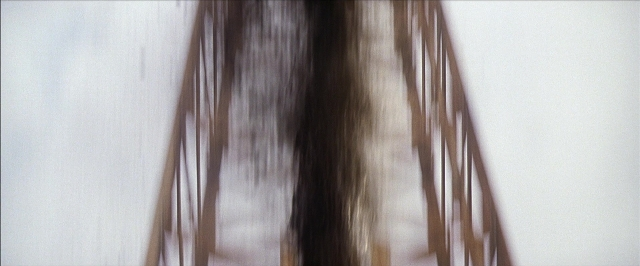 Frame from There Will Be Blood — hair, curtain, person