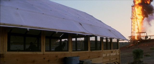 Wide shot frame from There Will Be Blood — door, house, window