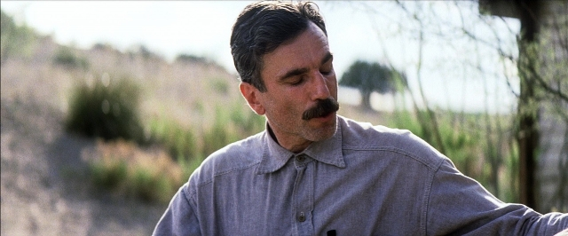 Frame from There Will Be Blood — standing, shirt, mustache