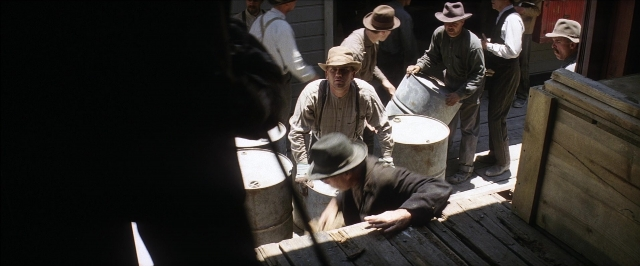 Frame from There Will Be Blood — standing, person, human face
