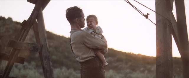 Frame from There Will Be Blood — standing, shirt, face
