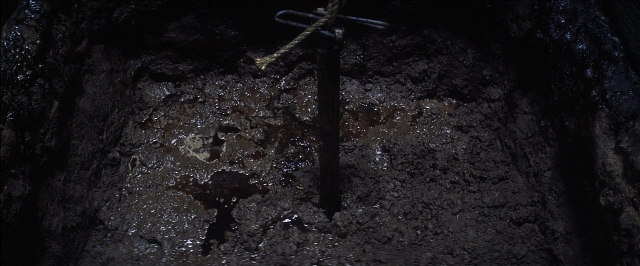 Wide shot frame from There Will Be Blood — water, nail