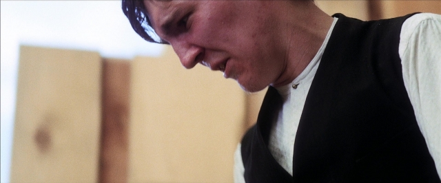 Frame from There Will Be Blood — room, shirt, face