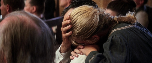 Frame from There Will Be Blood — sitting, room, hair