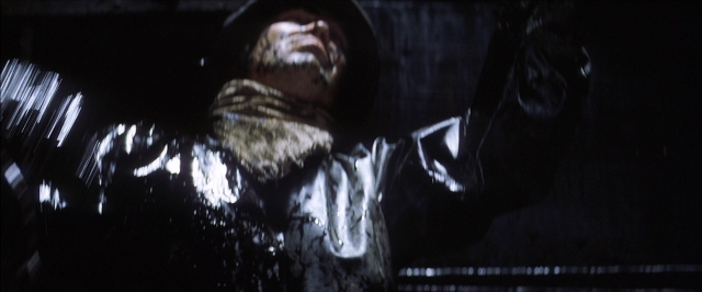 Wide shot frame from There Will Be Blood — room, person, human face