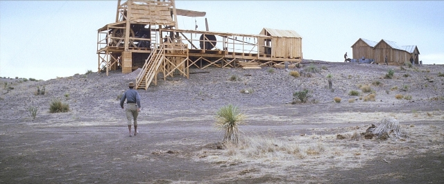 Wide shot frame from There Will Be Blood — standing, person