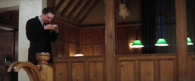 Wide shot frame from There Will Be Blood — standing, room, dialogue