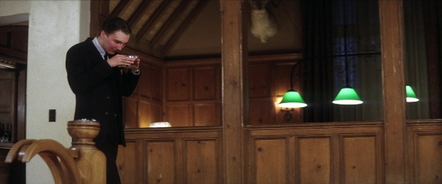 Wide shot frame from There Will Be Blood — standing, room, hand