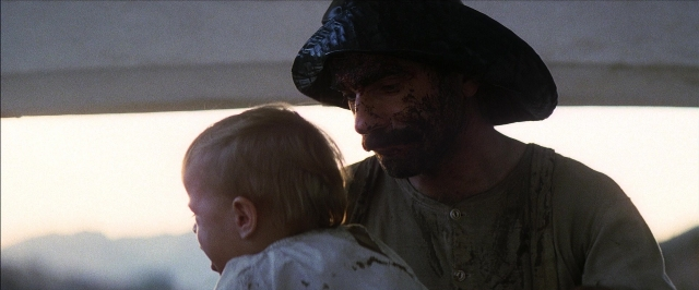 Frame from There Will Be Blood — standing, hat, shirt