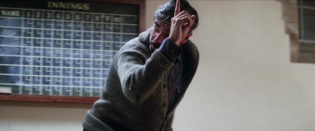 Wide shot frame from There Will Be Blood — standing, room, face