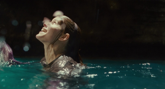 Medium shot frame from 127 Hours — water, hair, person