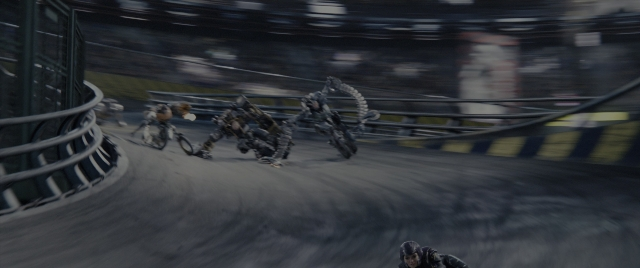 Frame from Alita: Battle Angel — bicycle, person