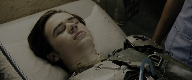 Wide shot frame from Alita: Battle Angel — room, bed, person