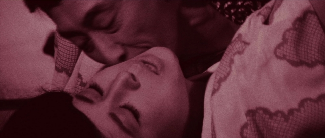 Frame from Kyôfu kikei ningen: Edogawa Rampo zenshû — bed, bedroom, person